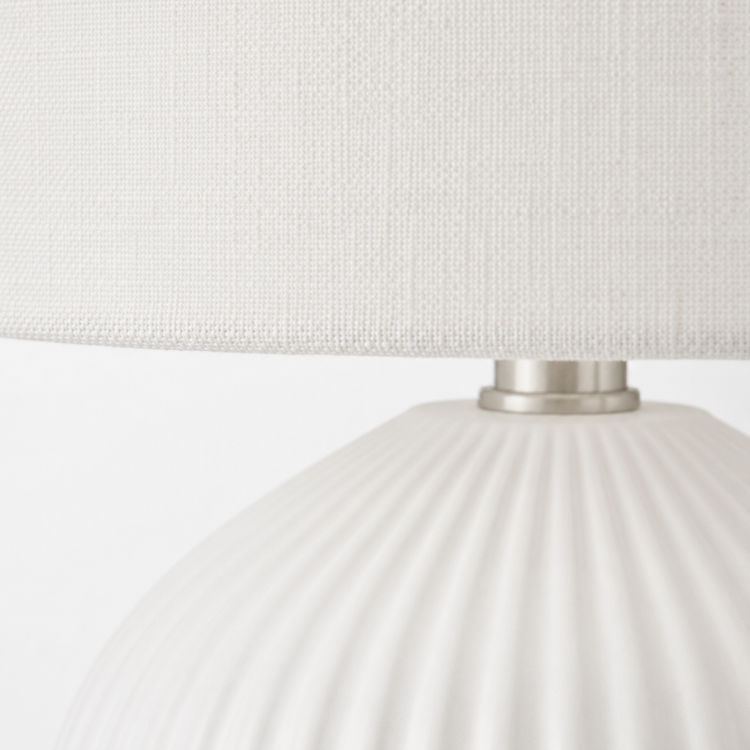 Macro close-up of the Zola 4688B table lamp in white, from the Zola family, revealing fine fabric weave on the 40 cm shade and brushed metal base detail, designed for a 1xE27 bulb, contemporary refined style for living and bedroom interiors, by Marcottestyle.