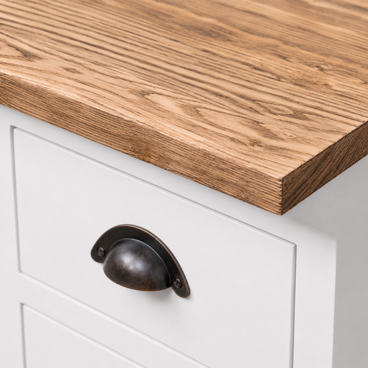 Close-up of brushed natural wood top and aged bronze cup handle on white Hampton vanity