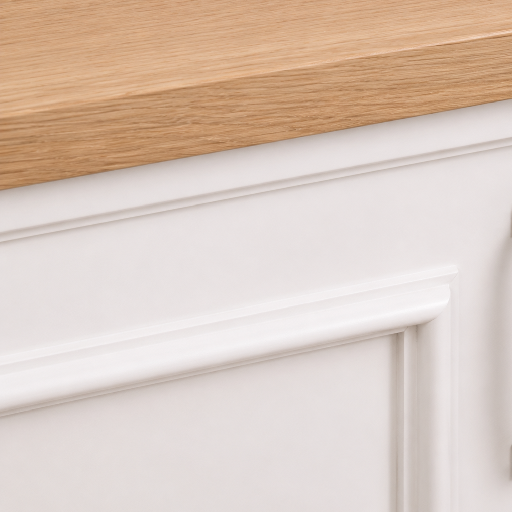 Close-up of the natural oak countertop edge and white paneled cabinet molding, Stratford Compact vanity