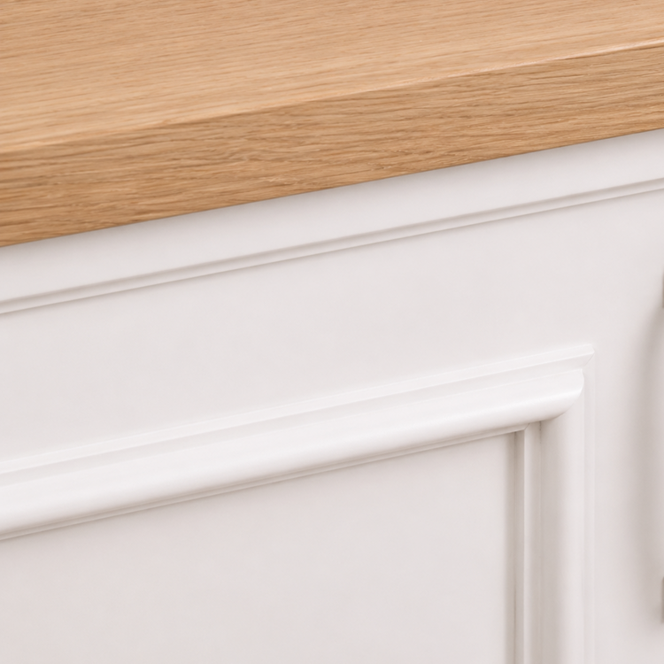 Close-up of the natural oak countertop edge and white paneled cabinet molding, Stratford Compact vanity