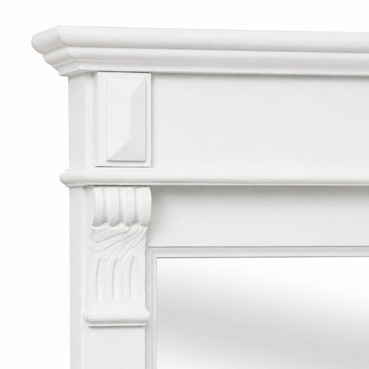 Close-up of the Baldo mirror crown moulding and carved block corbel in white painted pine