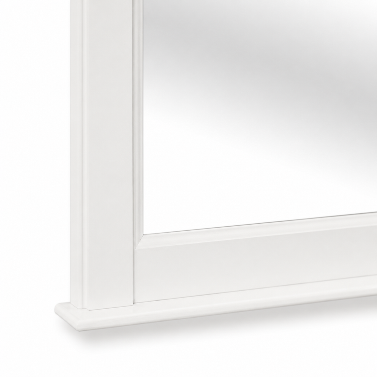 Close-up of the white painted pine Baldo mirror frame corner and base moulding