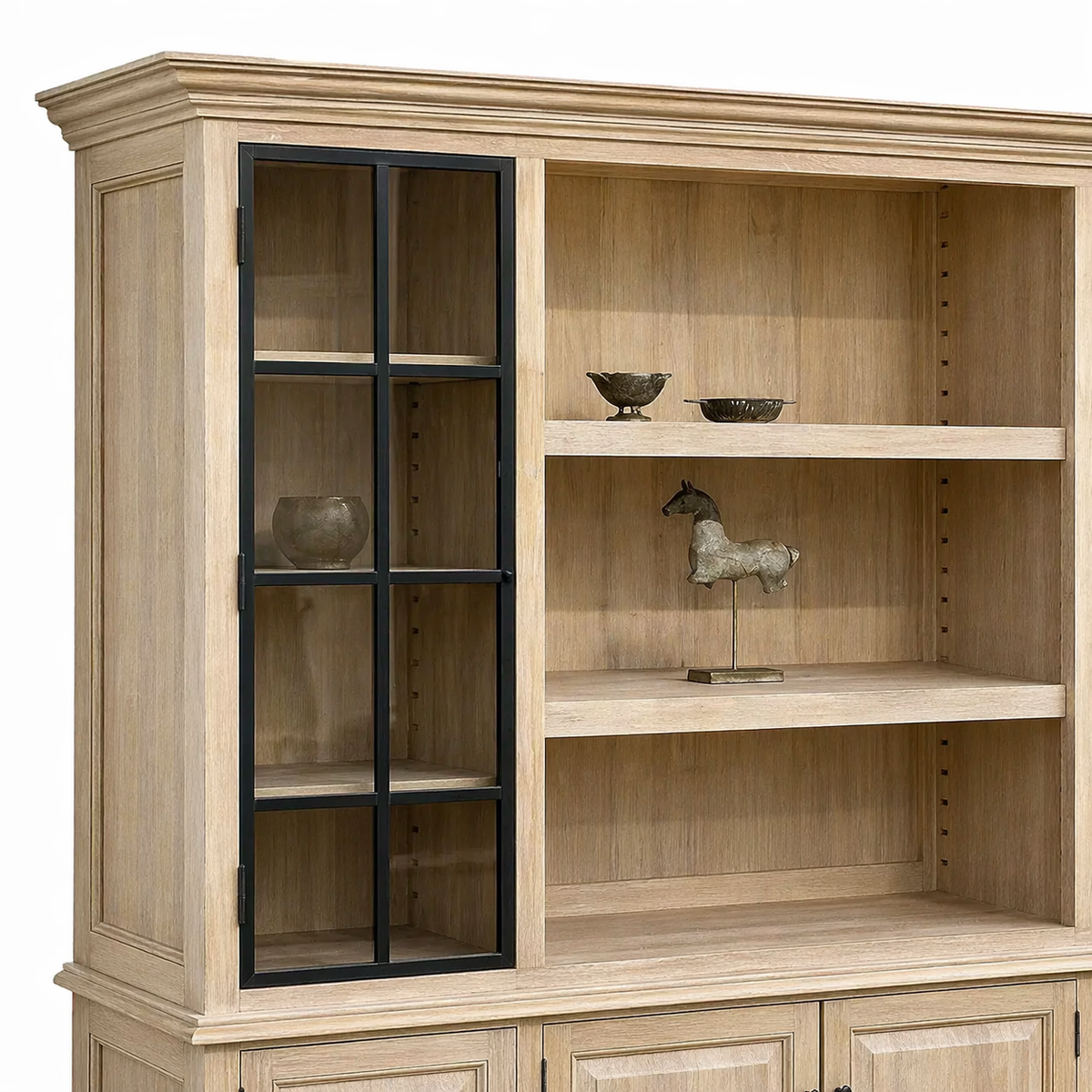 Glazed doors and adjustable oak shelves of the country-style Harrison display cabinet, styled with decor