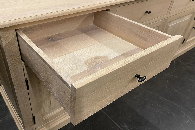 Open dovetailed solid oak drawer of the country-style Harrison display cabinet, natural oak grain