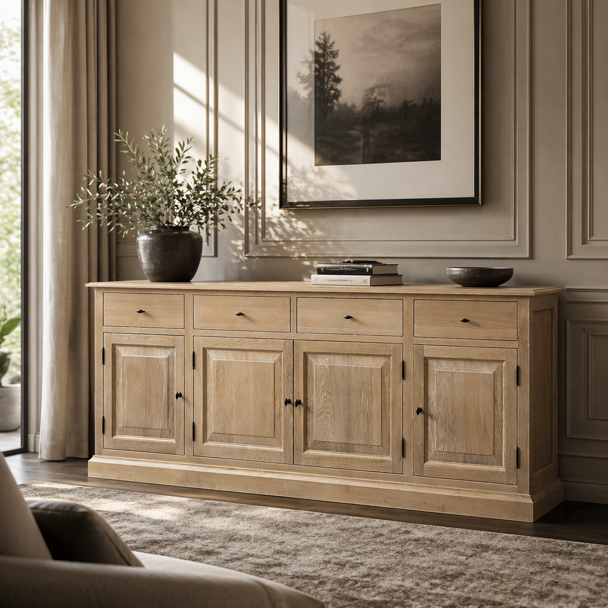 Country-style natural oak Arden sideboard styled in a living room with olive branches and framed artwork