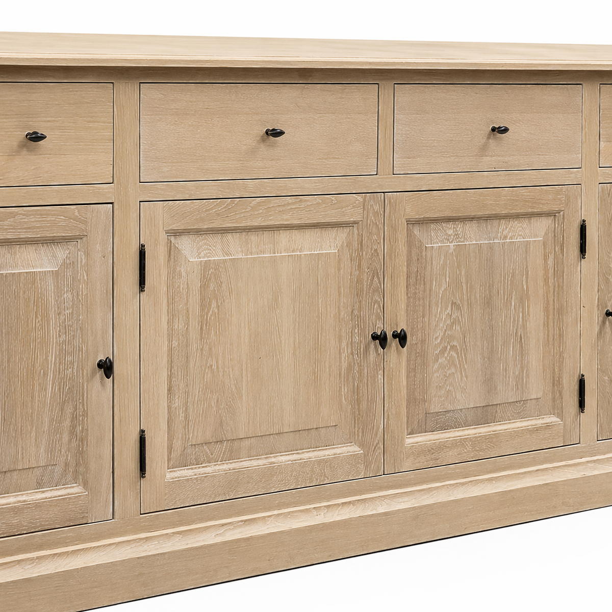 Close-up of the natural oak Arden sideboard showing raised-panel doors, limed grain and black diamond knobs