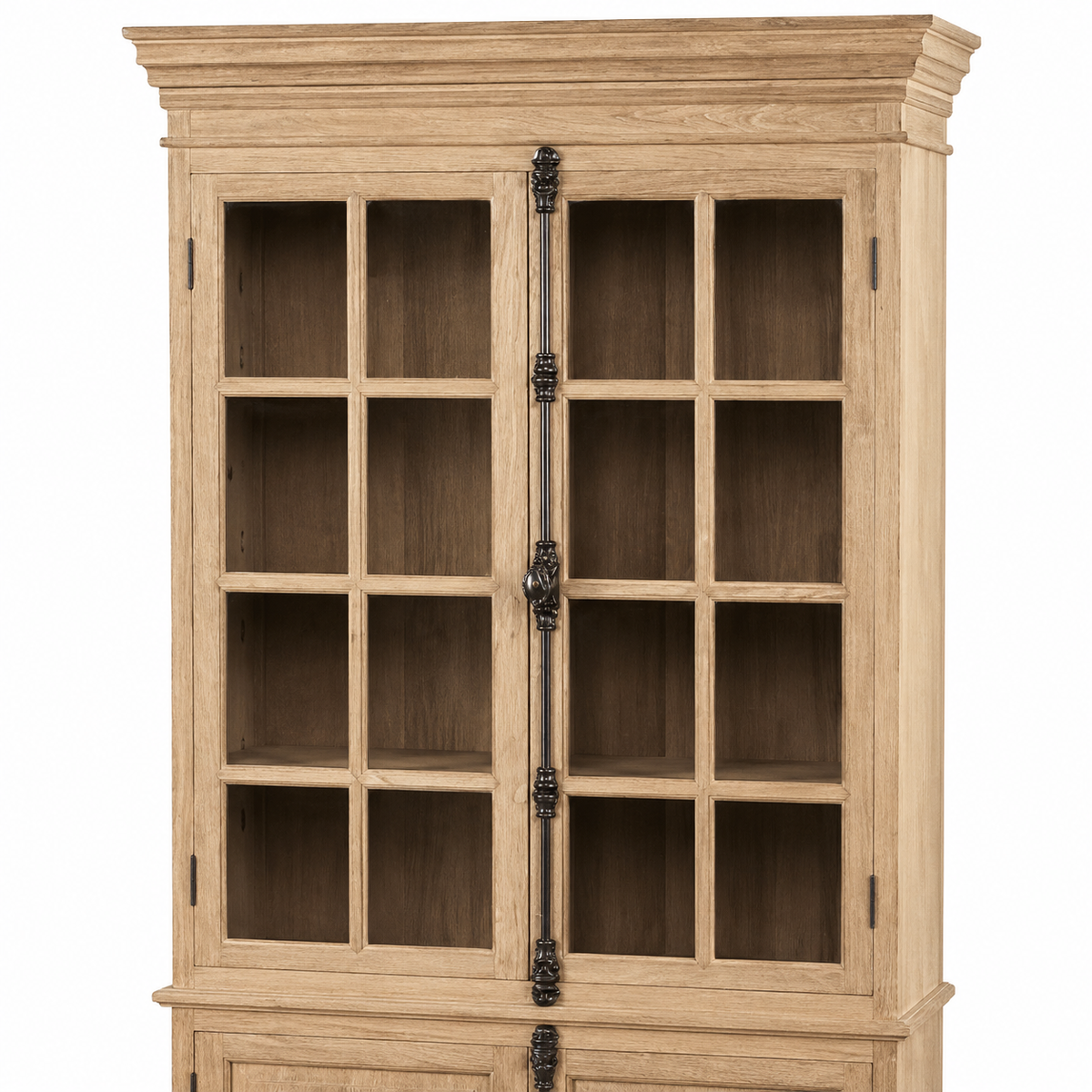 Detail of the oak Villars display cabinet showing black window-pane glazed doors and forged iron handle