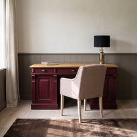 Desk Auxerre in bordeaux with oak top, in an interior, 140 x 70 x 78 cm
