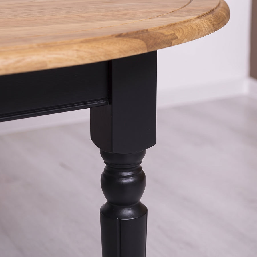 Dining Table Santenay in black with oak top, close-up of the finish and construction, 160 x 120 x 78 cm