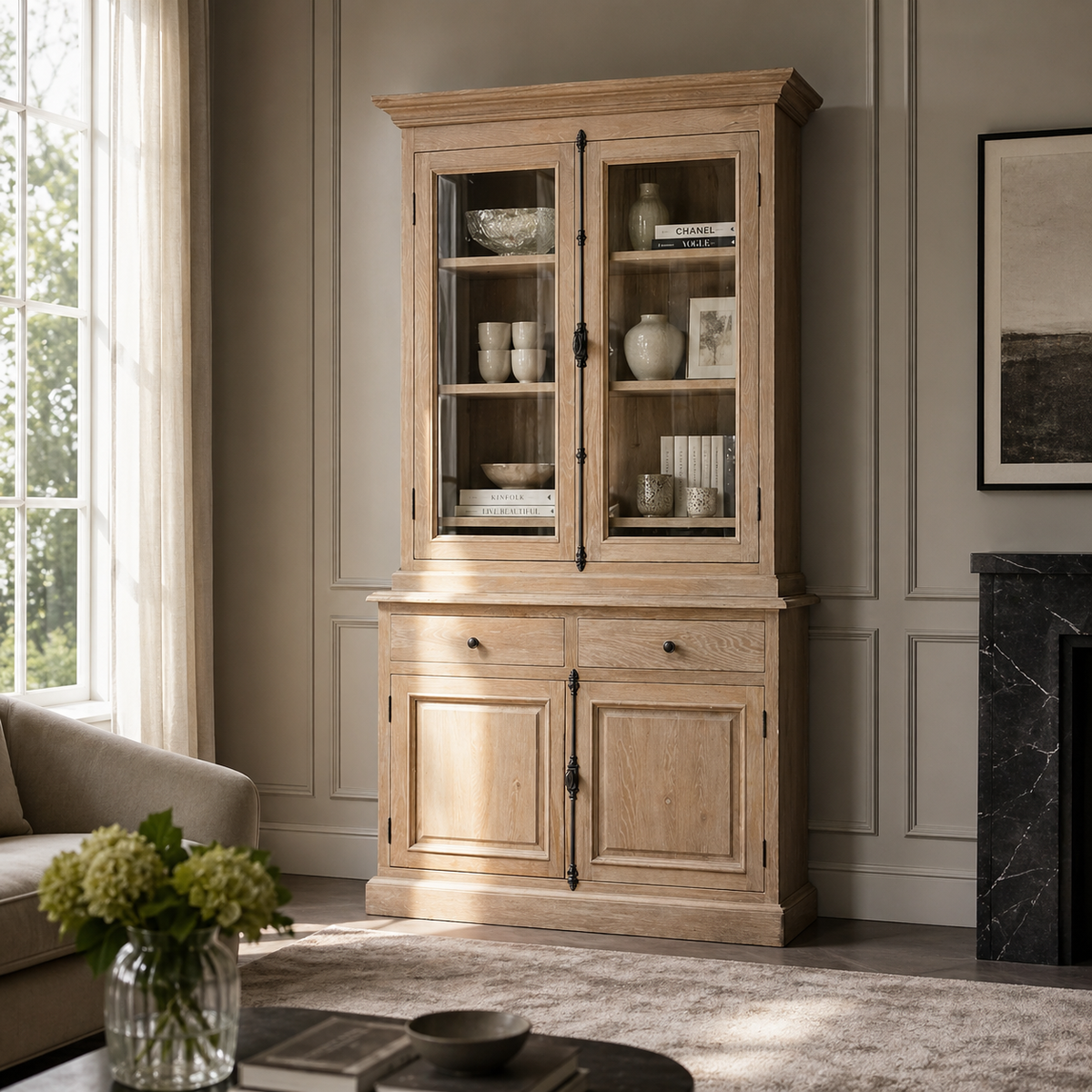 Weathered oak Olon display cabinet styled in a living room with glazed doors and decor, farmhouse style