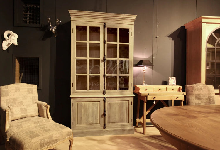 Country-style oak Villars display cabinet in a styled interior with armchair and dining table
