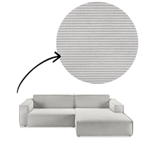 Sofa Midtown - Silber close-up of corduroy fabric texture mit arrow indicator, highlighting soft ribbed upholstery for tactile comfort.