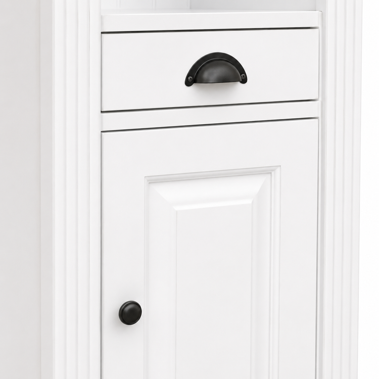 Detail of black cup drawer handle and round knob on the white Westcott bathroom cabinet door