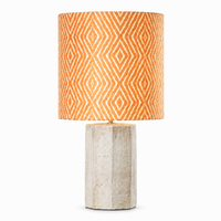 Tischlampe Aurora 7768L cream mit lamp turned on showing warm glow through woven diamond fabric shade, front view on white background by Marcottestyle