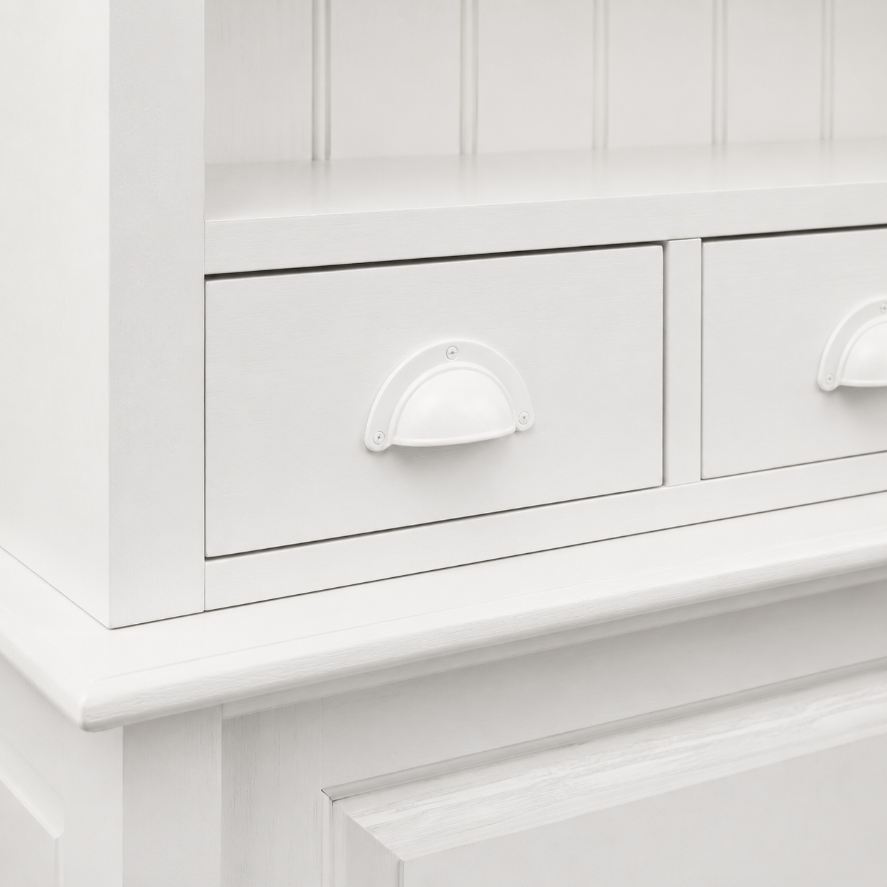 Close-up of the white finish and detailing of the Pauillac bar cabinet