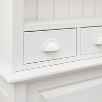 Close-up of the white finish and detailing of the Pauillac bar cabinet