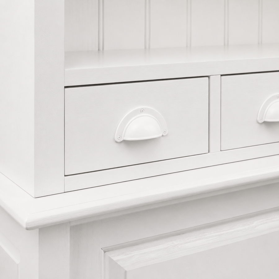 Close-up of the white finish and detailing of the Pauillac bar cabinet