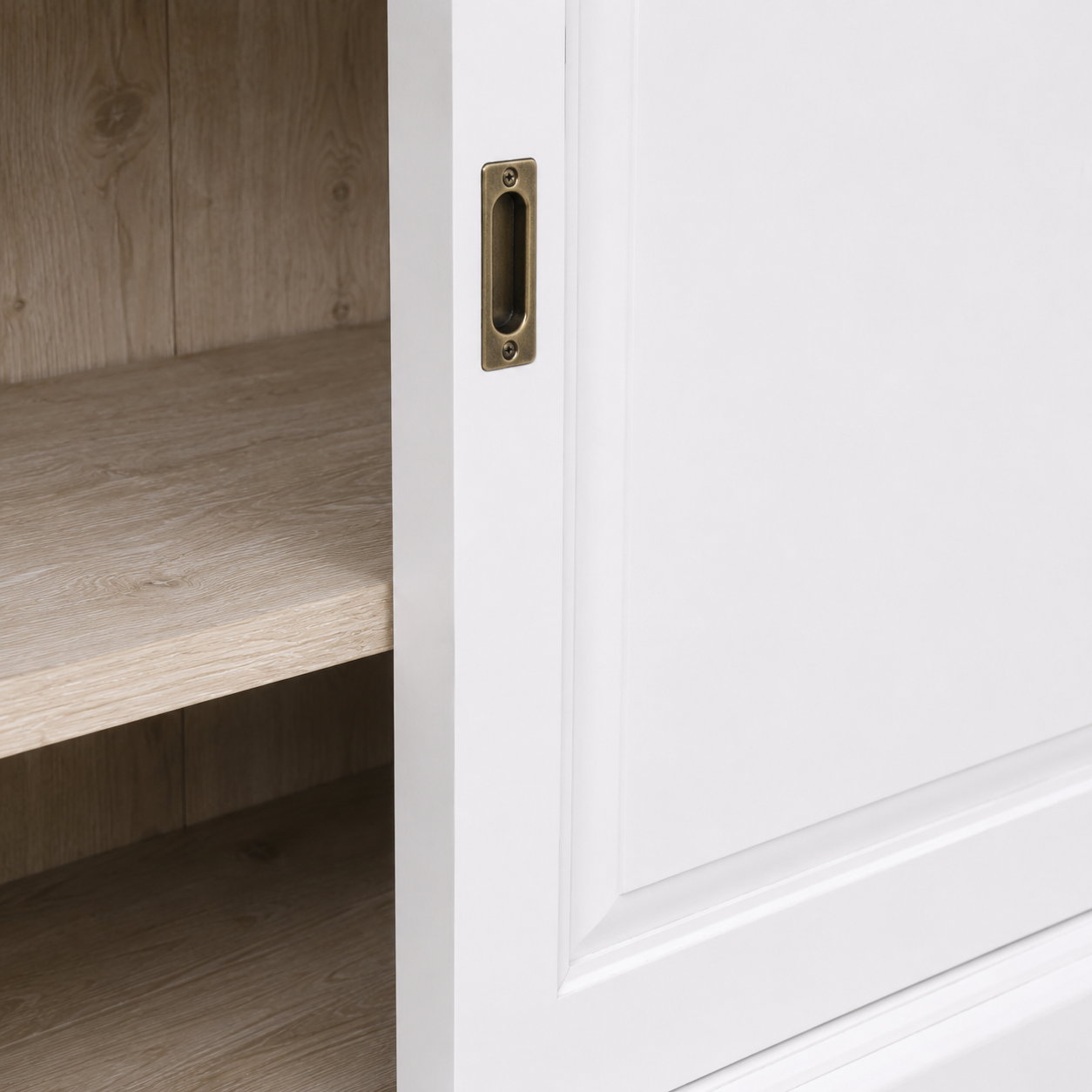 Close-up of the white finish and detailing of the Thouars bar cabinet