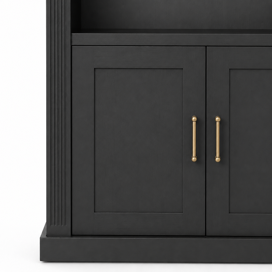 Close-up of black Arcade bookcase lower cabinet with shaker panel doors and brass pull handles