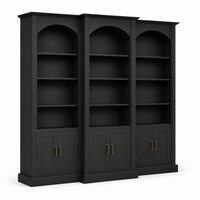 Angled view of black solid pine Arcade triple arched bookcase with brass handles, 250 cm high