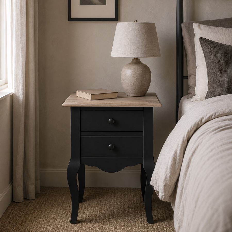 Cahors nightstand in black with oak top styled in a bedroom