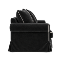 Castilliano country sofa in black velvet with white piping, side view
