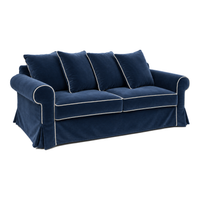 Castilliano country sofa in navy blue velvet with white piping, three-quarter view
