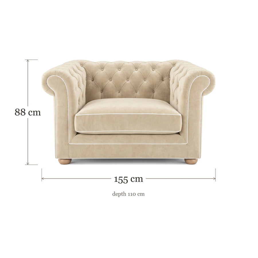 Chesterfield loveseat in cream velvet with white piping, dimensions 155 x 110 x 88 cm