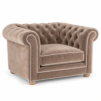 Chesterfield loveseat in beige velvet with white piping, three-quarter view