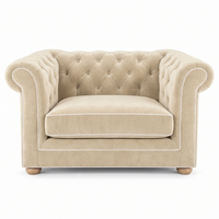 Chesterfield loveseat in cream velvet with white piping, front view