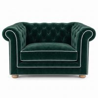 Chesterfield loveseat in forest green velvet with white piping, front view