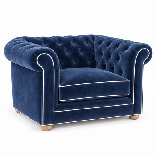 Chesterfield loveseat in navy blue velvet with white piping, three-quarter view