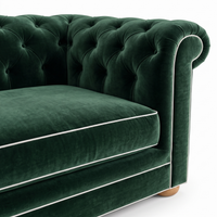 Chesterfield sofa in forest green velvet with white piping, velvet and piping detail