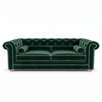 Chesterfield sofa in forest green velvet with white piping, front view
