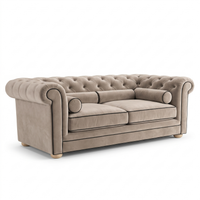 Chesterfield sofa in greige velvet with black piping, three-quarter view