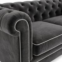 Chesterfield sofa in grey velvet with white piping, velvet and piping detail