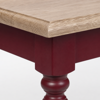 Close-up of the bordeaux finish and oak top detailing of the Pomerol coffee table