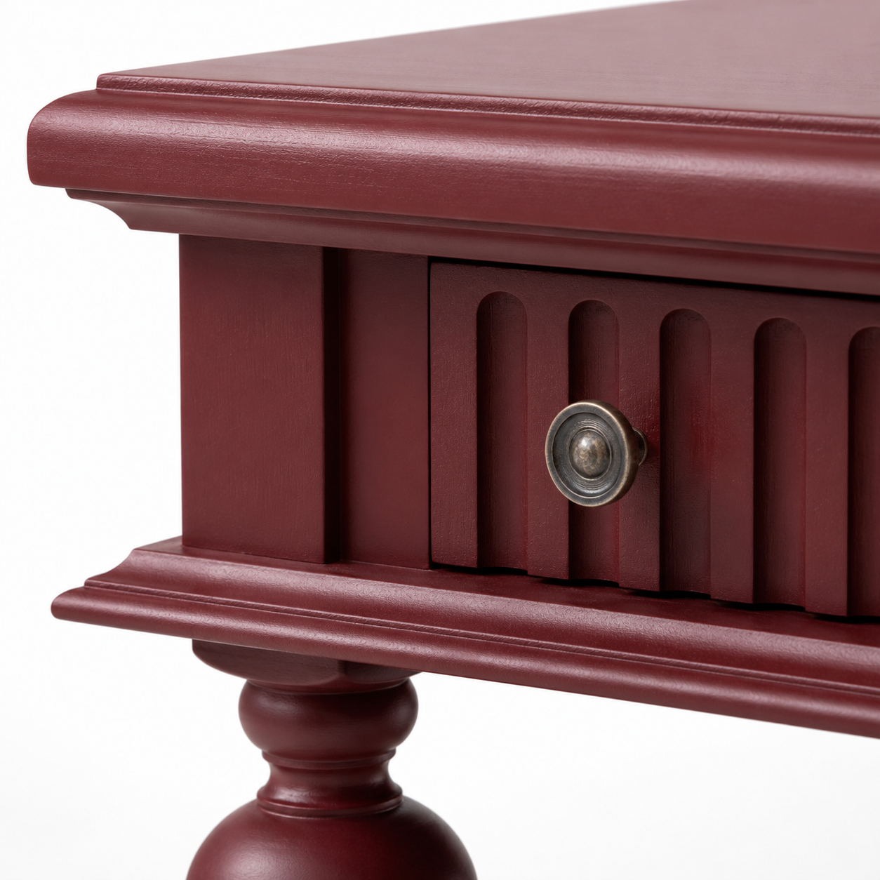 Close-up of the bordeaux finish and fluted detailing of the Gaillac console table
