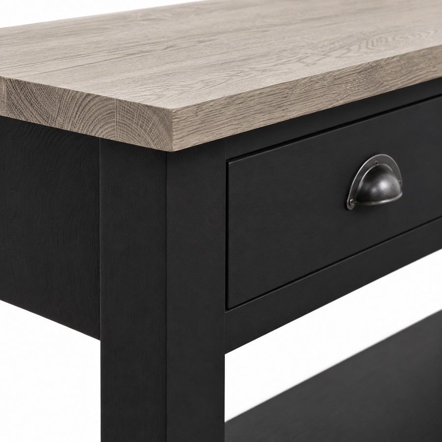 Close-up of the black finish, oak top edge and cup pull detailing of the Rully console table