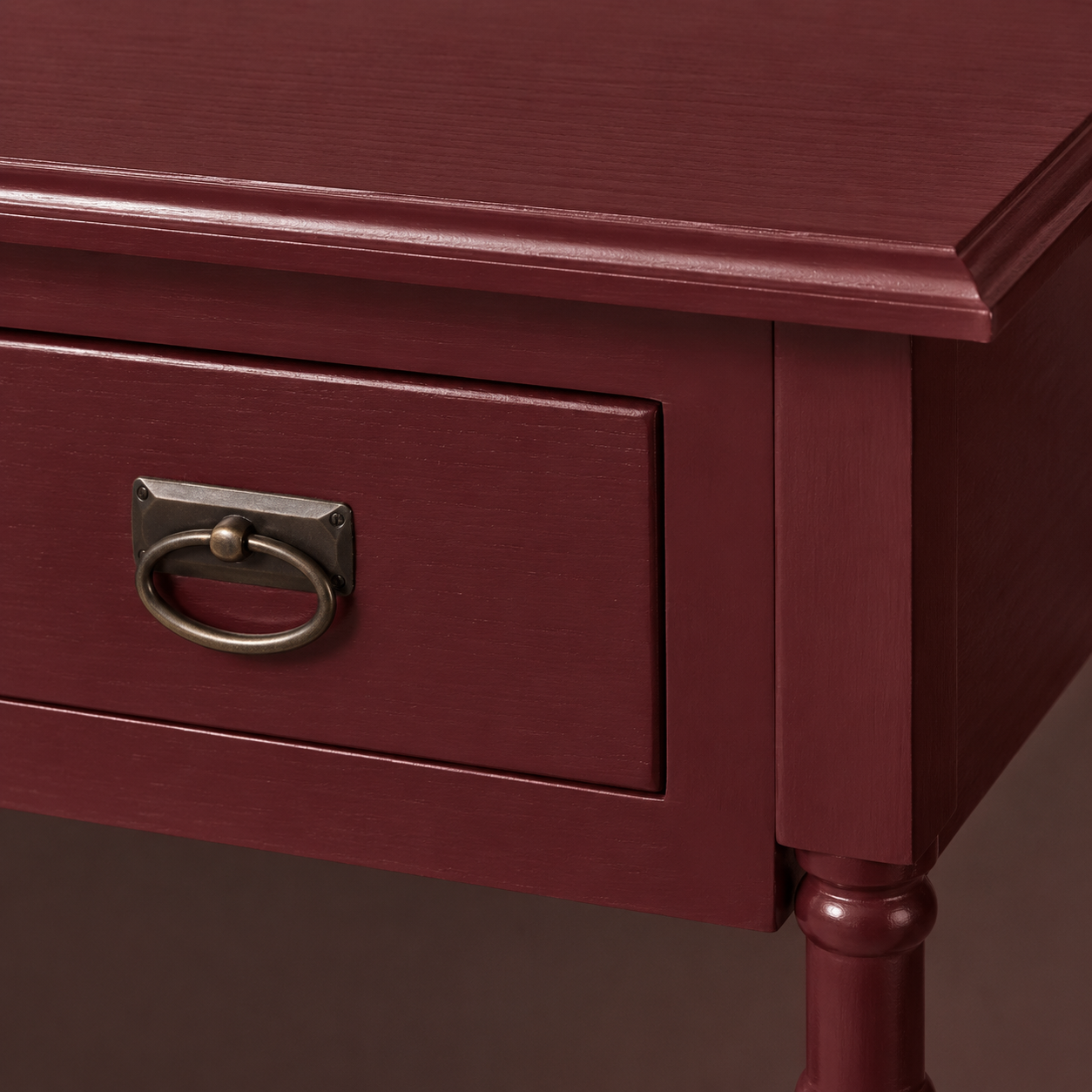 Close-up of the bordeaux finish and detailing of the Tournus console table