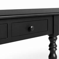 Close-up of the black finish and detailing of the Auray desk