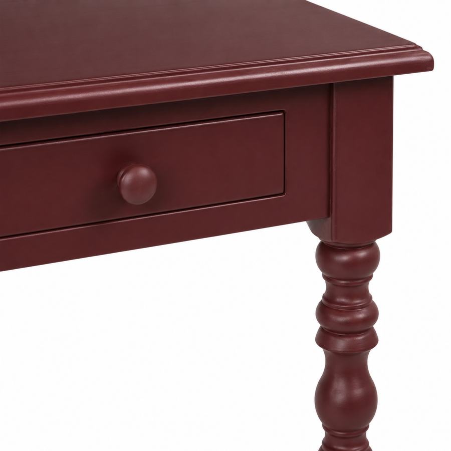 Close-up of the bordeaux finish and detailing of the Auray desk
