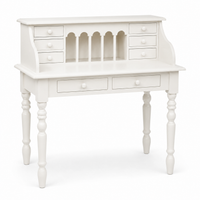 Classic white solid pine Dinan desk, three-quarter view showing turned legs and six small drawers