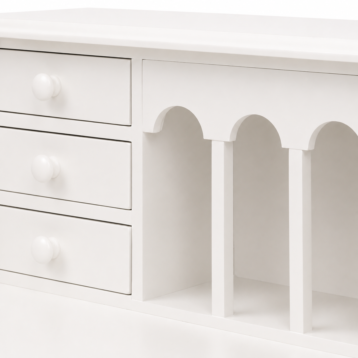 Close-up of the small drawers and arched pigeonholes on the classic white Dinan desk