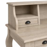 Close-up of the cup handle and natural oiled oak grain on the classic Vendome desk