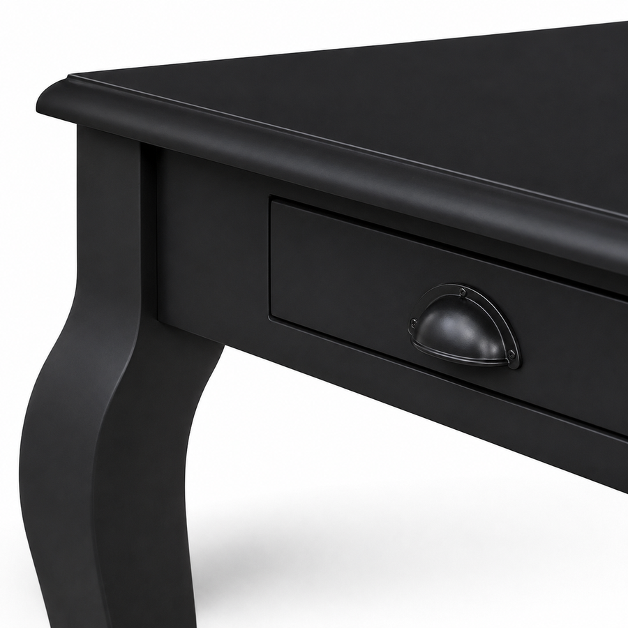 Close-up of the cup handle and curved leg on the classic black solid pine Vendome desk