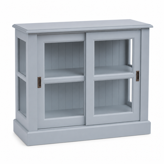 Coastal light blue Honfleur pine display cabinet with glass sliding doors, three-quarter angle, 106 cm wide