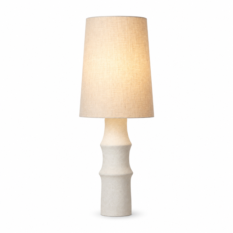 Table Lamp Jora 5663J white ceramic base with linen shade gently illuminated from within, soft warm glow through fabric on white background, professional product photography by Marcottestyle