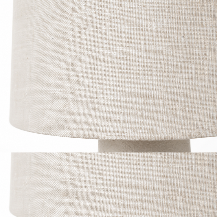 Close-up macro detail shot of Table Lamp Jora 5663J showing intricate linen fabric weave texture and white ceramic surface finish at high resolution, professional macro photography by Marcottestyle