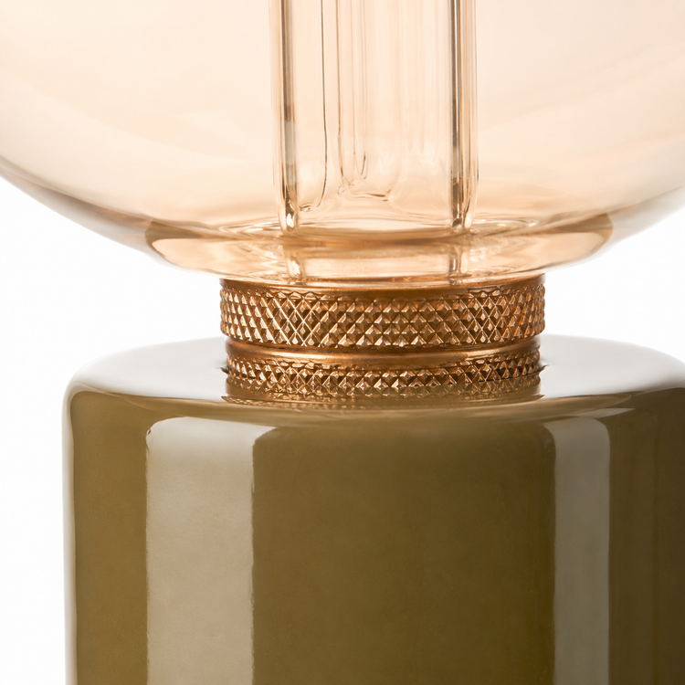Close-up macro detail shot of Table Lamp Jutta 7472X showing olive green ceramic base texture and glass globe finish at high resolution by Marcottestyle